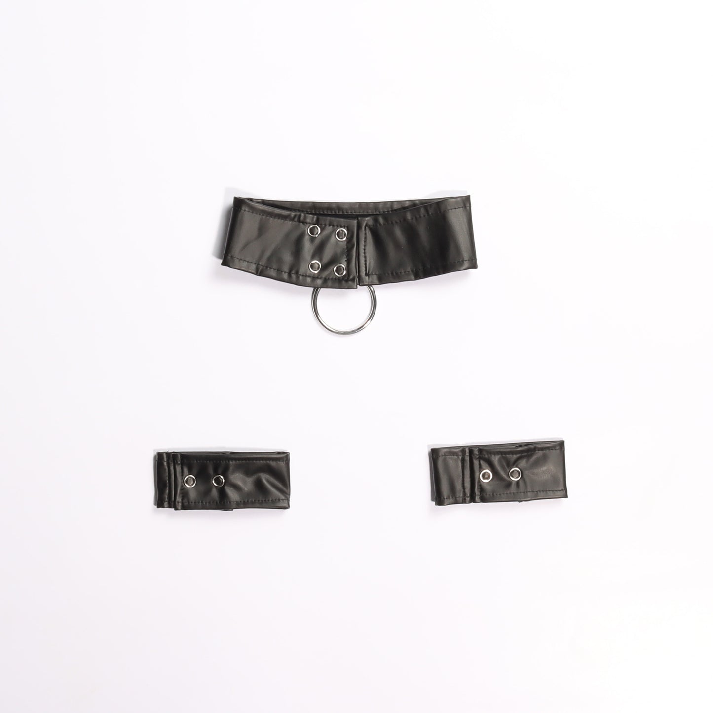 Image of back of quality faux leather collar and wrist cuffs in black with a metal O ring on a white background