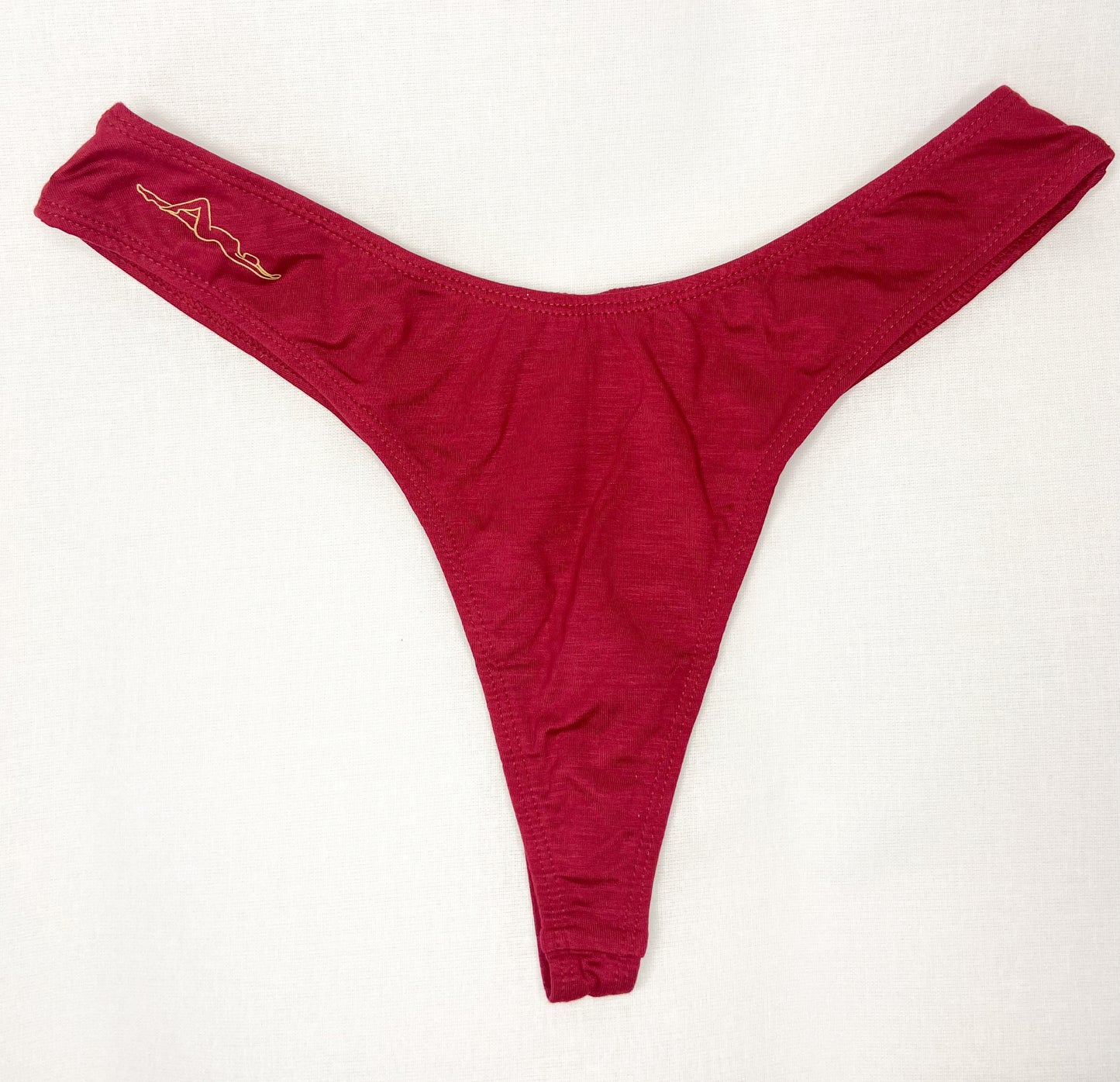 Image of Viva Magenta Kelle'sFinery Tencel Spandex underwear laid out on a white background