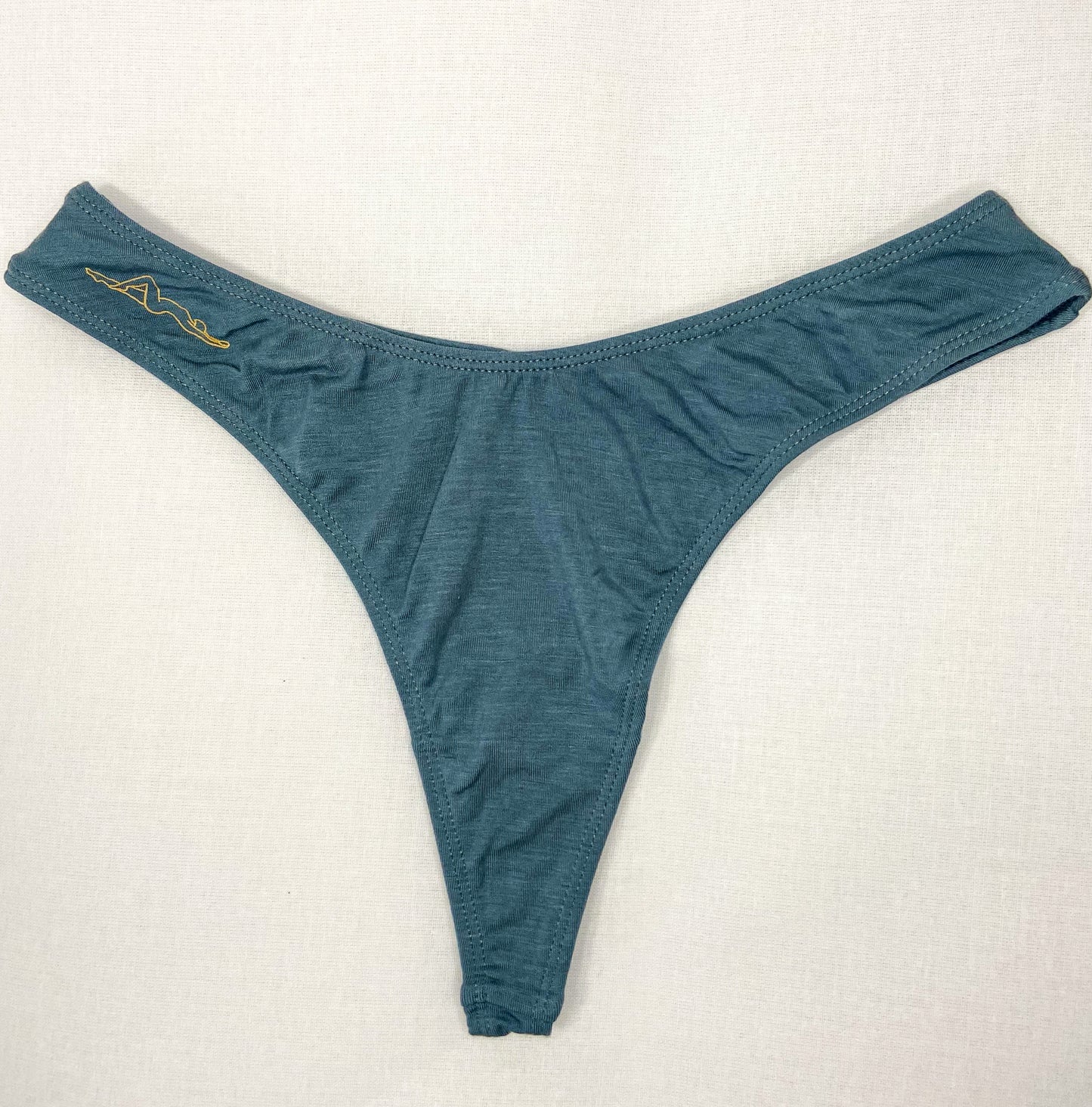 Image of upcycled Dark Blue Kelle'sFinery Tencel Spandex underwear laid out on a white background